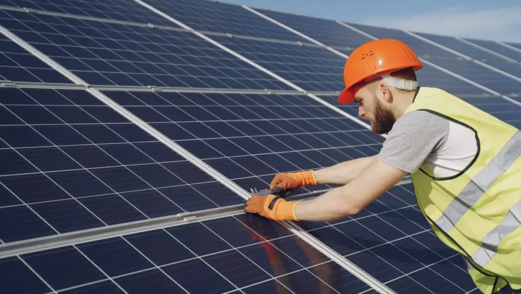 Roofer installing solar tile roof