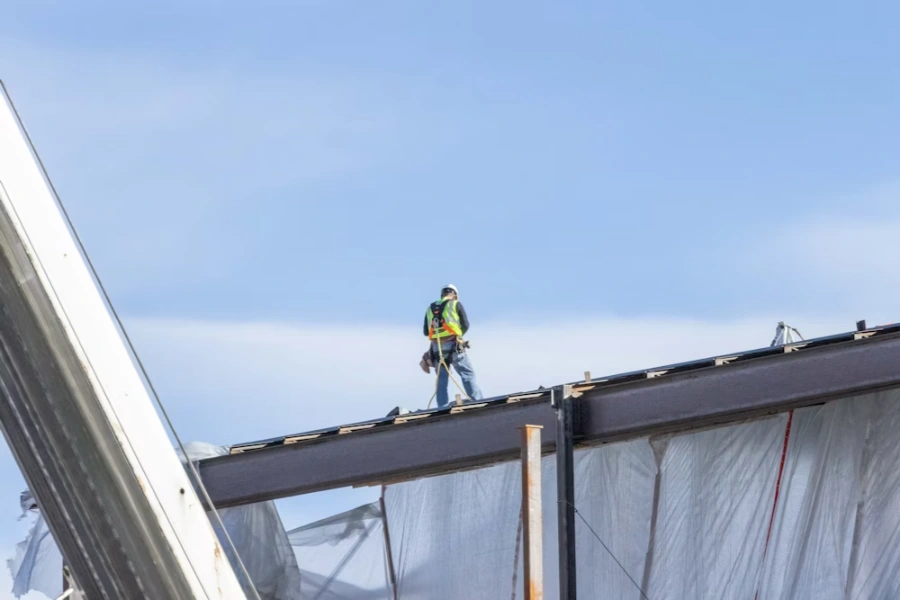 residential roofer inspecting the building's roof structure