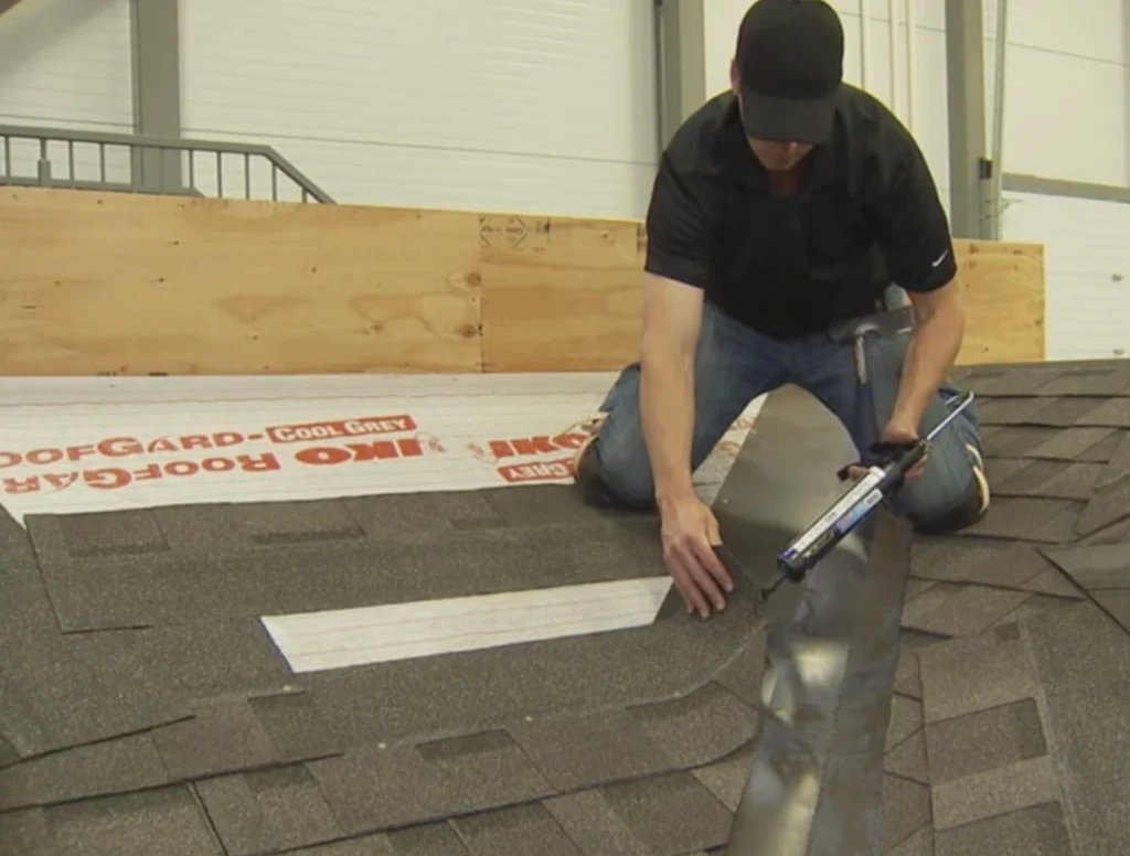 professional roofer installing architectural shingles