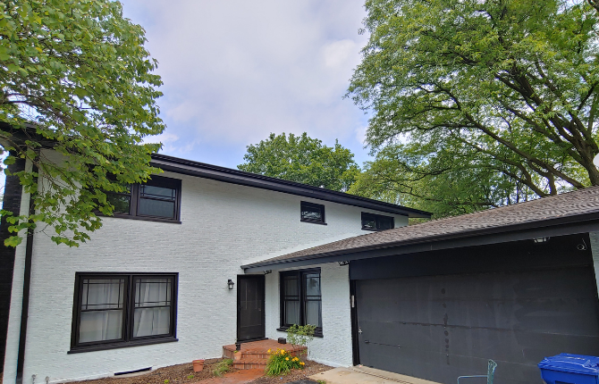 black trim off-white exterior brown roof