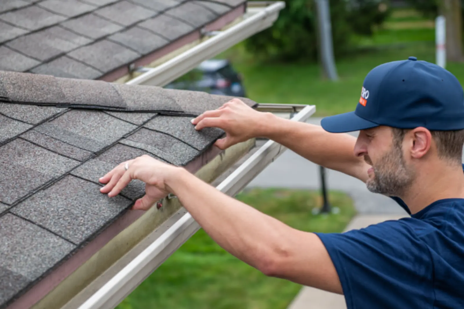 HomeHero Roofing owners with a homeowner after final walkthrough