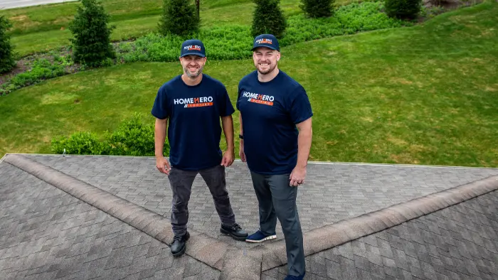 Andre and Matt from HomeHero Roofing on site during a roofing project
