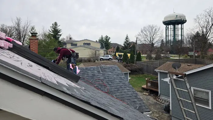 Roofers completing a residential roofing project in Downers Grove
