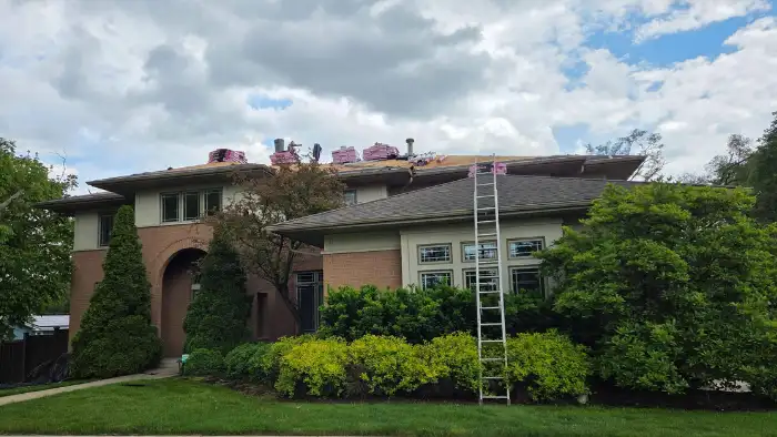 large house roofing job in progress