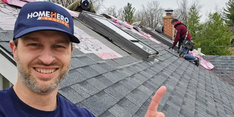 Specialized roofing crew installing residential asphalt shingles with precision and focus