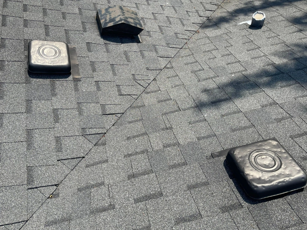 Hail-dented roof vents documented on a July 27, 2026 storm inspection